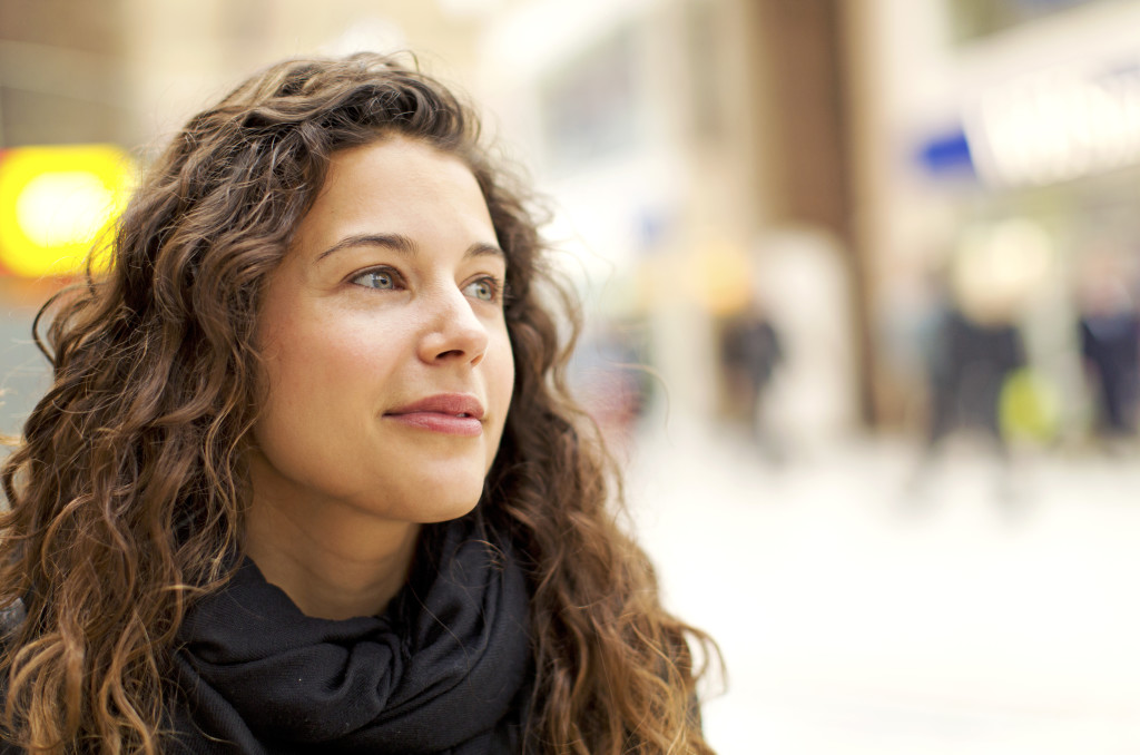 Woman smiling after an intensive outpatient program
