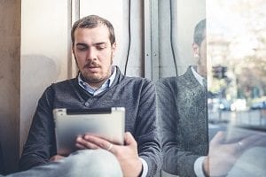 man on tablet