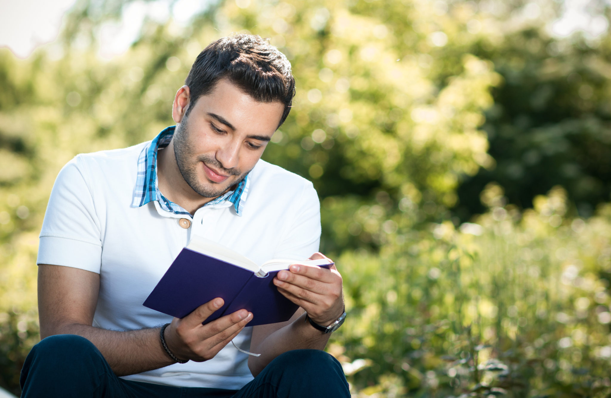 man sitting and reading