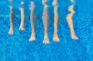 family legs underwater