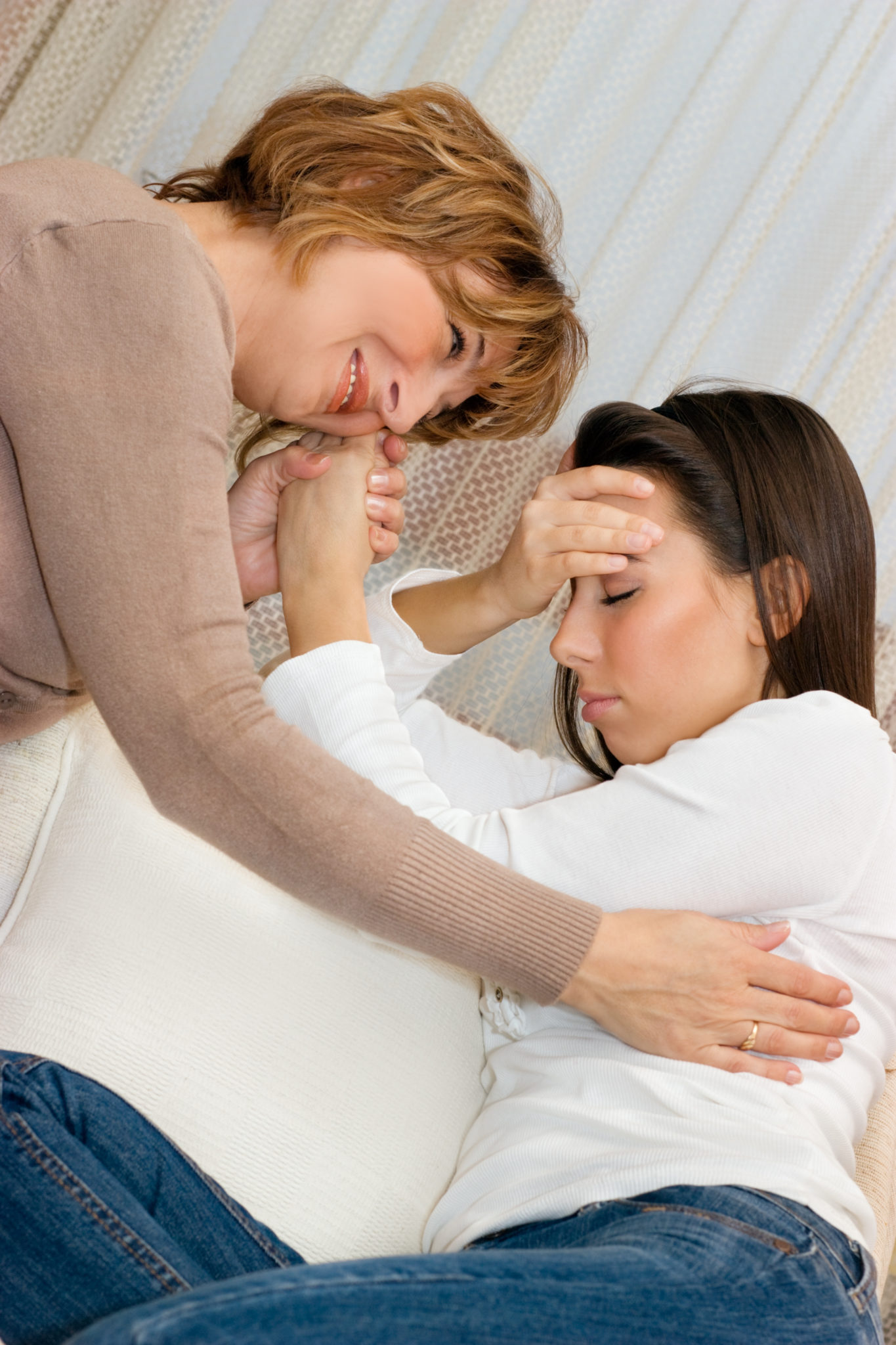 Mom helping sad daughter