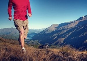 man jogging in mountain