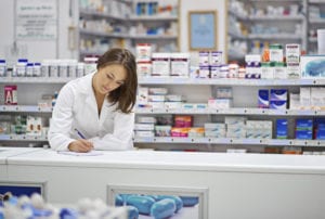 woman writing Prescription