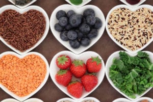 heart shaped bowls of healthy foods