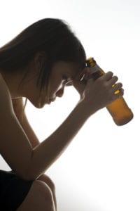 depressed girl drinking alcohol