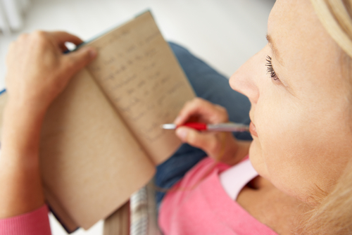 girl writing in journal