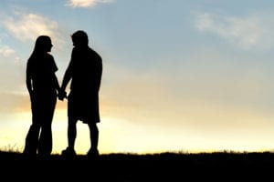 couples backlit in sun