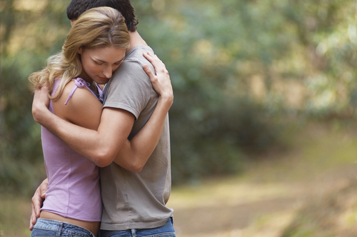 couple hugging outside