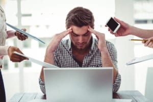 stressed man ignoring people