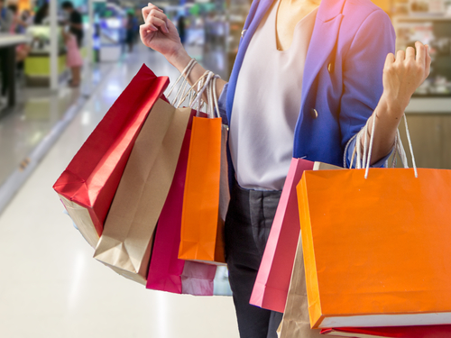 woman holding shopping bags