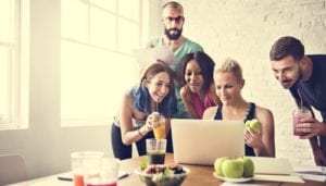 group of people looking at computer