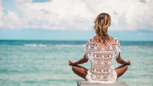 woman doing yoga on dock