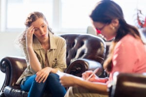 anxious woman talking with therapist