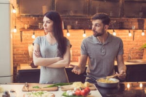 couple arguing in kitchen
