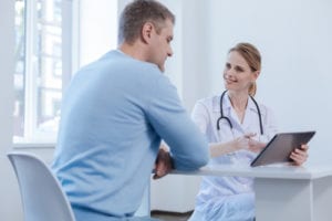 female doctor with male patient