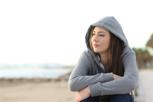 adolescent looking away from camera