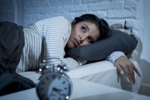 woman awake in bed