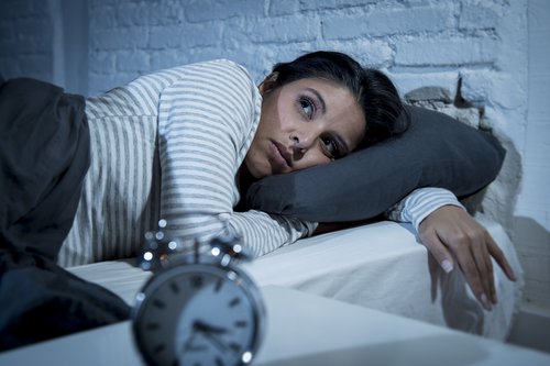 woman awake in bed