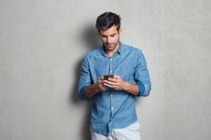 man texting on phone