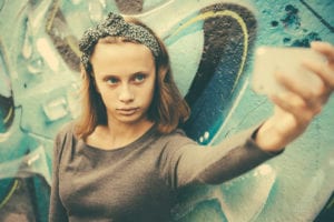 young girl taking selfie