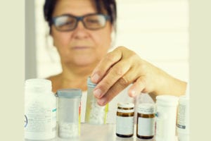 woman looking at medicine