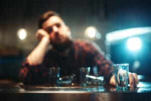 blurry image of man at bar