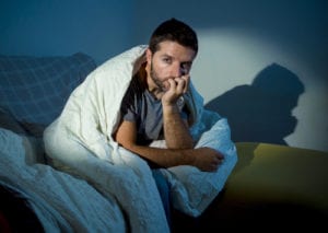 anxious guy in bed