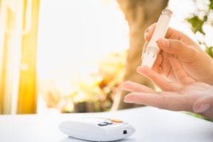 person checking Blood Sugar