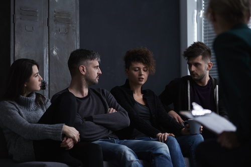 people in dark room in meeting