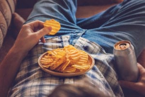 bowl of chips on someone's belly