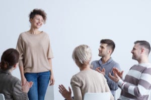 Woman sharing story with group
