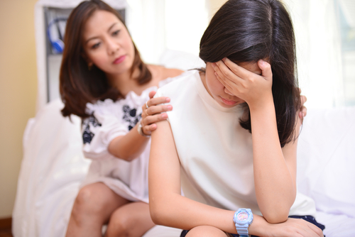 woman comforting friend