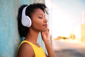 smiling woman listening to headphones