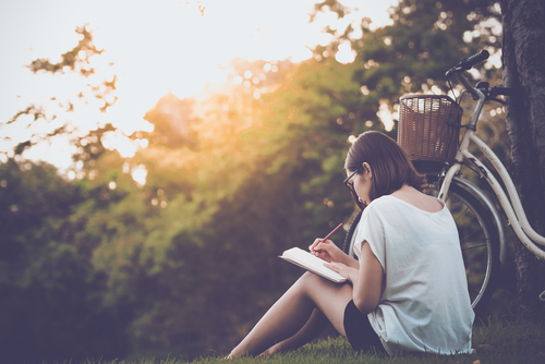 woman writing in notebook