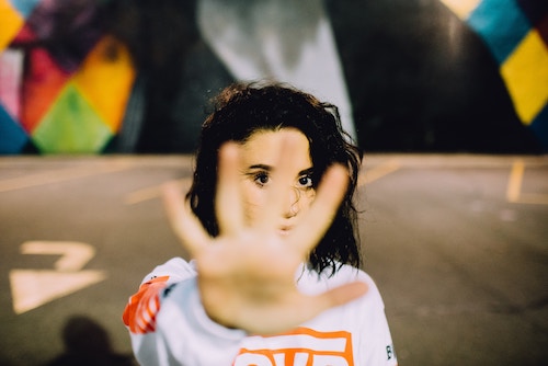 Woman with hand in STOP motion