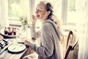 Woman enjoying with sweet dessert cake