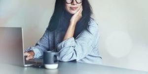 Woman working on a laptop at home