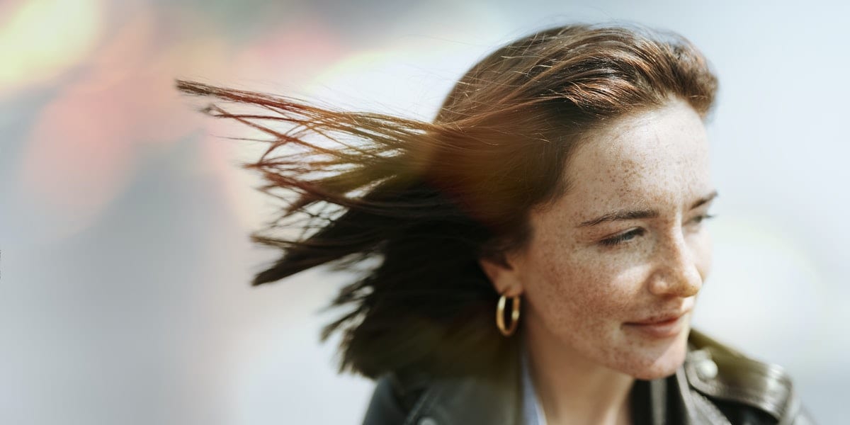 Happy woman enjoying the breeze