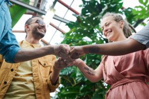 happy people having fist bump