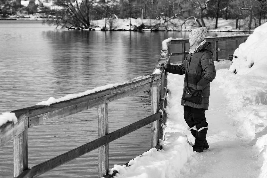 woman looking at the lake