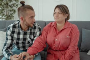 couple holding hands during therapy